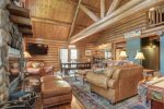 Bear Butte Gulch Lodge living room with wood burning fireplace.